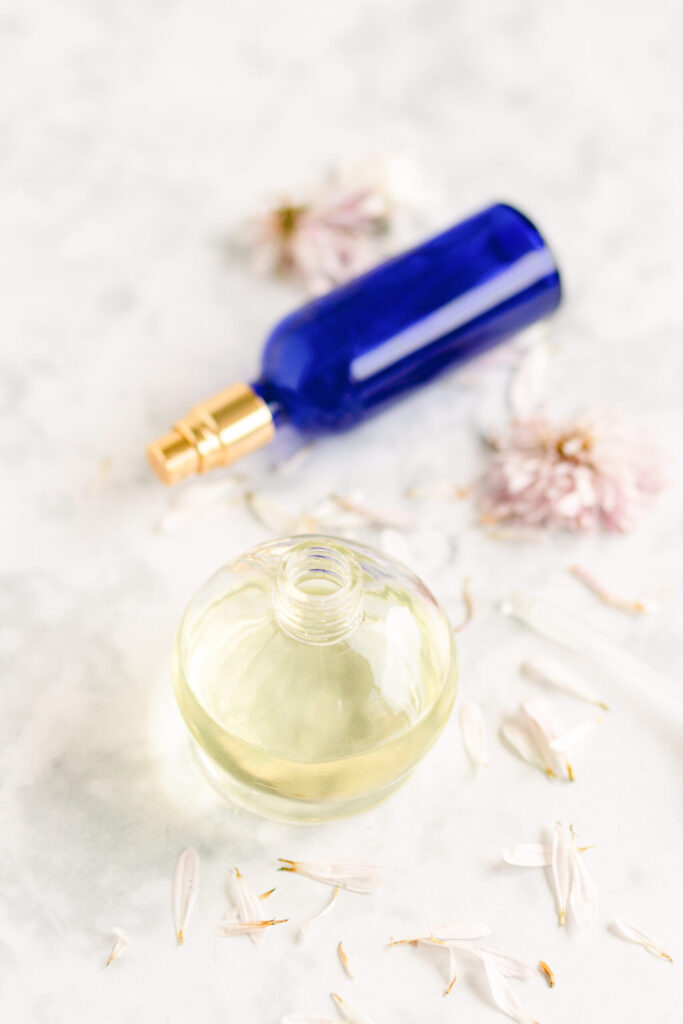 bottles of perfume with peonies